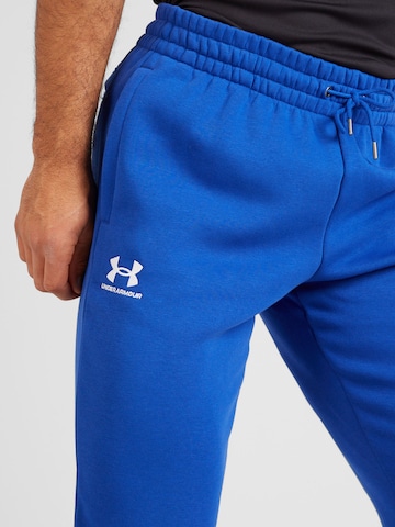 UNDER ARMOUR - Tapered Calças de desporto 'Essential' em azul
