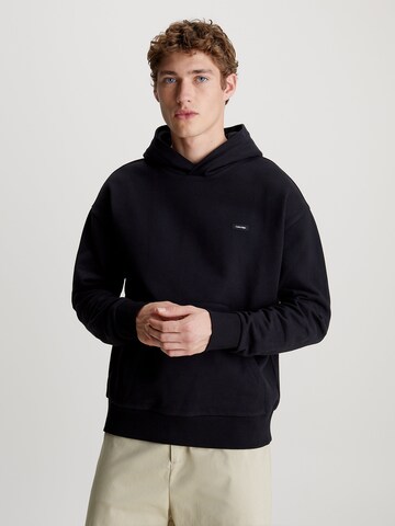 Sweat-shirt Calvin Klein en noir : devant