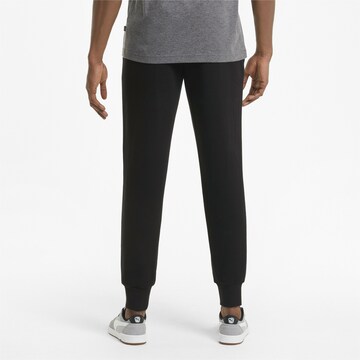 PUMA Tapered Sportbroek in Zwart