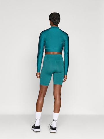 Skinny Pantaloni sportivi 'Motion' di UNDER ARMOUR in verde