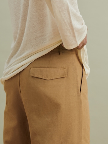 DAN FOX APPAREL Regular Pleat-Front Pants 'Matti' in Brown