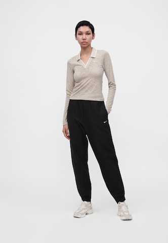 Nike Sportswear - Tapered Pantalón 'Studio' en negro
