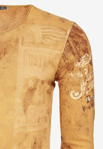 Rusty Neal Langarmshirt mit plakativem Front & Back Print in Braun