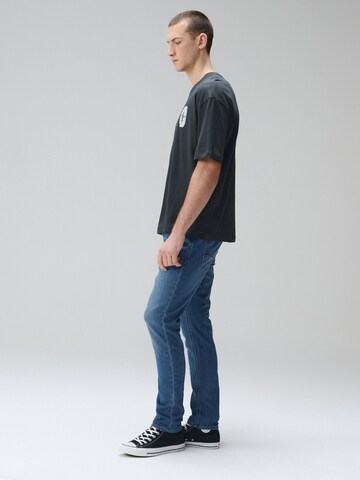 Next Slimfit Farmer 'Motion Flex' - kék