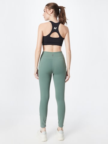 SKECHERS Skinny Workout Pants in Green