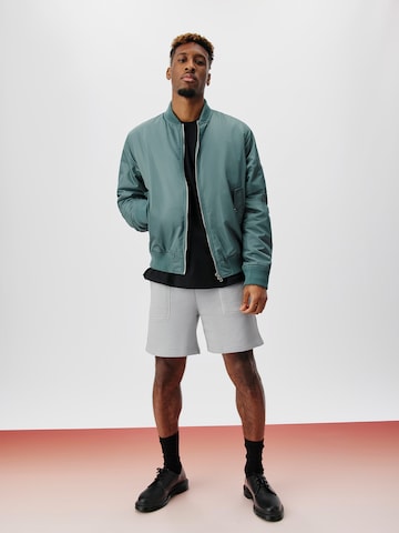 ABOUT YOU x Kingsley Coman Between-Season Jacket 'Colin' in Green