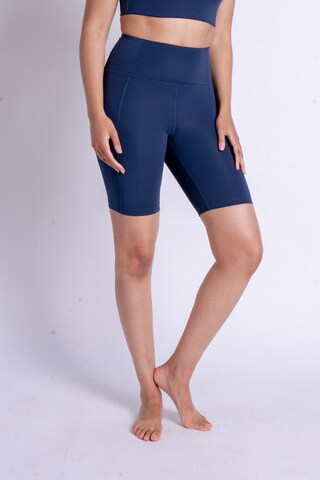 Girlfriend Collective Skinny Sportbroek in Blauw: voorkant