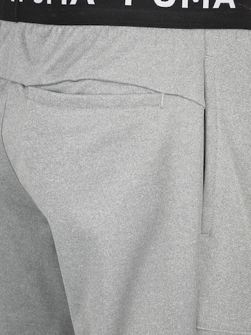 PUMA Tapered Sportbroek in Grijs