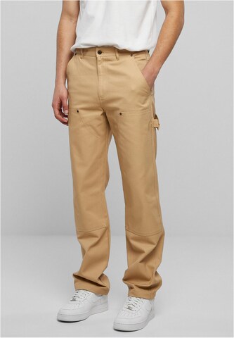 Karl Kani Regular Trousers in Beige: front