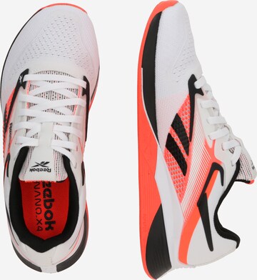 balts Reebok Sporta apavi 'NANO X4'