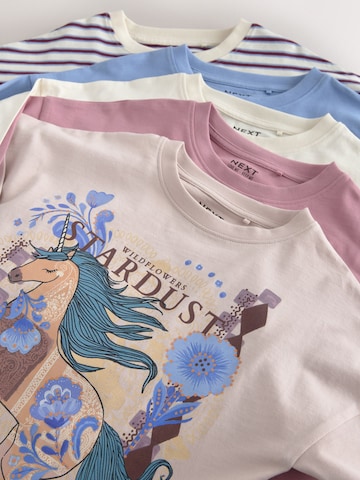 Tricou de la Next pe bej