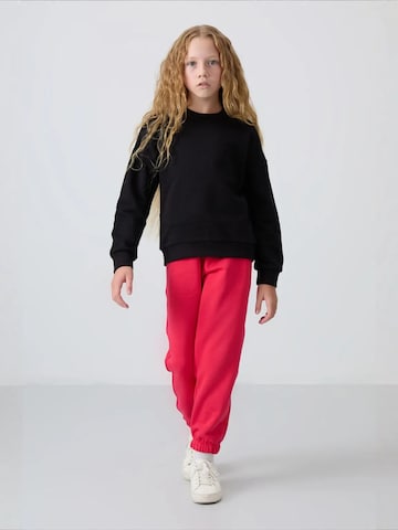 Tommy Life Bluzka sportowa 'TOMMY Jugend-Unisex-Sweatshirt Aus Baumwollmischung' w kolorze niebieski