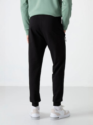 Tapered Pantaloni di Tommy Life in nero