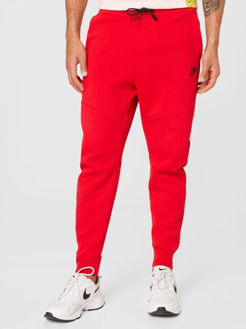 Nike Sportswear - Tapered Calças 'Tech Fleece' em vermelho: frente