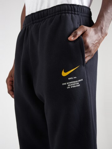 Nike SportswearTapered Hlače - crna boja