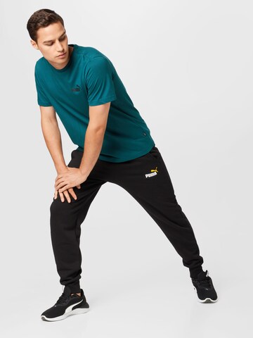 Tapered Pantaloni sport de la PUMA pe negru