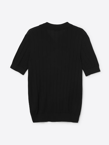 Maglietta 'DANTA regular merino knit polo shirt' di FILA in nero