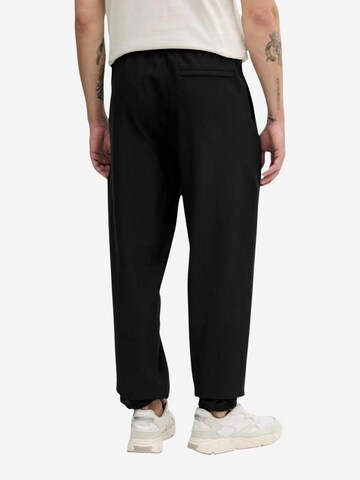 Calvin Klein Jeans Regular Sportbroek 'PREMIUM TERRY MONOGR LV04RC279G' in Zwart