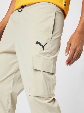 PUMA Regular Workout Pants in Beige