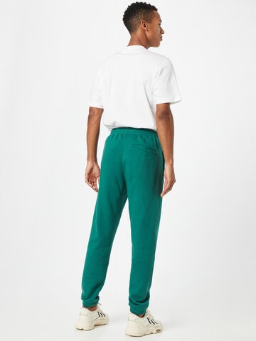 Tapered Pantaloni 'Spinner' di ADIDAS ORIGINALS in verde