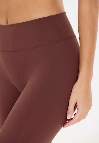 Athlecia Skinny Workout Pants 'Luxe' in Red