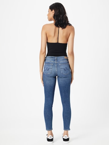 AG Jeans ضيق جينز بلون أزرق