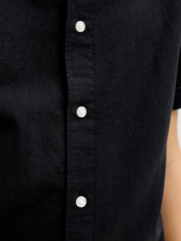 Coupe regular Chemise 'JJEBreeze' Jack & Jones Junior en noir