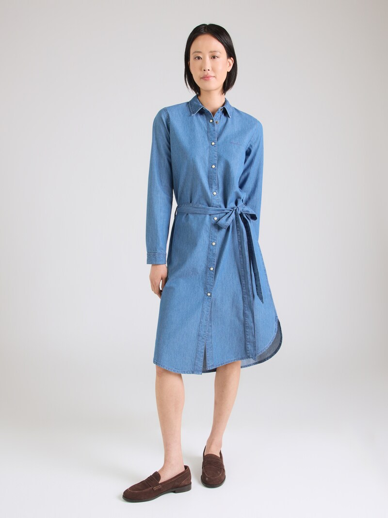 Woman in a chambray dress with loafers
