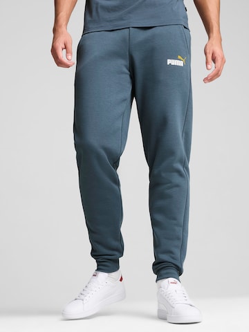 PUMA - Tapered Calças de desporto 'ESS+' em azul: frente