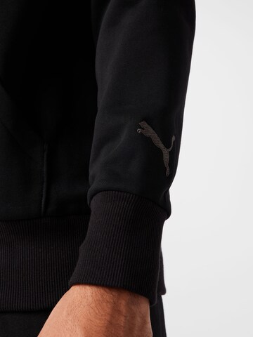 PUMASportska sweater majica 'Booster' - crna boja