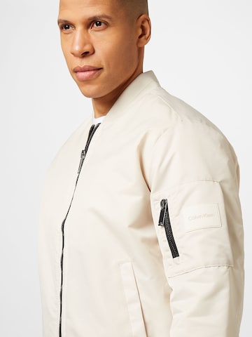 Calvin Klein Prehodna jakna 'Hero' | bež barva