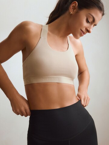 Bustino Reggiseno sportivo di Next in beige