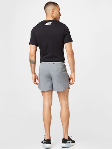 NIKE Regular Sports trousers in Grey