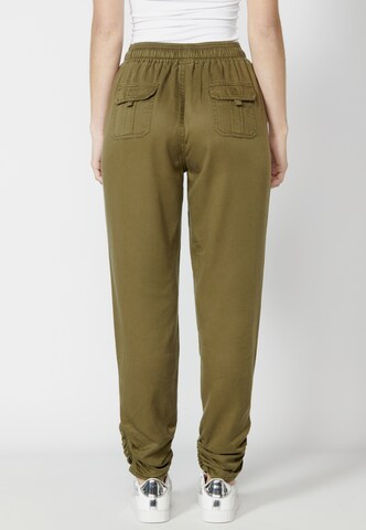 KOROSHI Tapered Jeans in Green