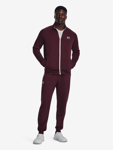 UNDER ARMOUR Tapered Sportbroek in Rood