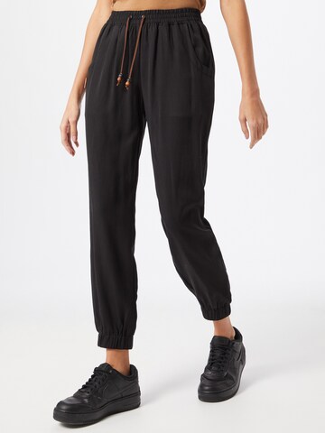 Alife and Kickin Tapered Pants in Black: front