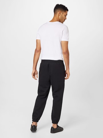 Tapered Pantaloni 'Premium Essentials' di ADIDAS ORIGINALS in nero