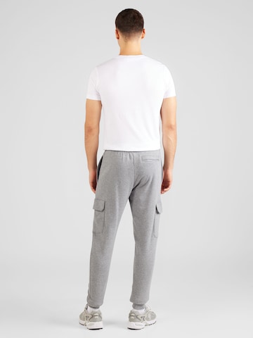 Effilé Pantalon de sport 'Rival' UNDER ARMOUR en gris