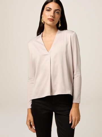 Top di oltre in beige: frontale