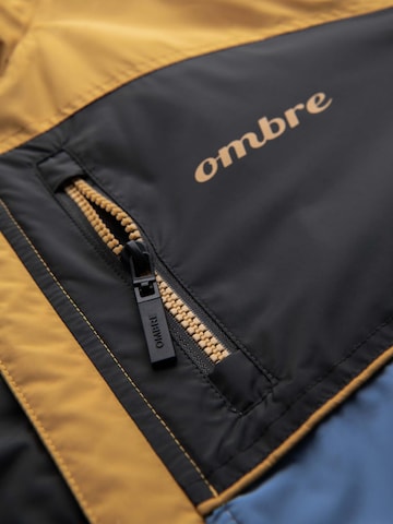 Ombre Přechodná bunda – modrá