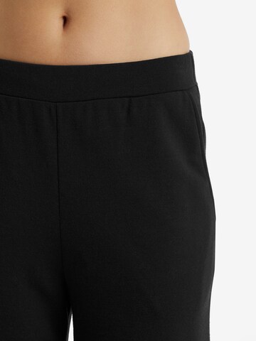 Wide leg Pantaloni sportivi 'Dalston' di ICEBREAKER in nero