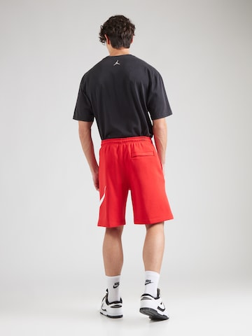 Largi Pantaloni 'CLUB' de la Nike Sportswear pe roșu