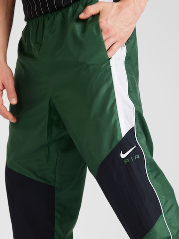 Nike Sportswear Alt kitsenev Püksid 'Air', värv roheline