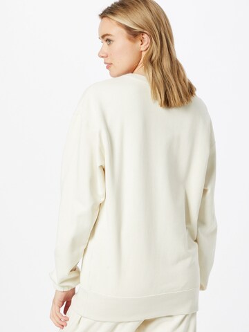 PUMA Sports sweatshirt 'PUMAxABOUT YOU' in Beige