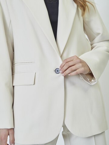 Blazer 'Vola' co'couture en blanc