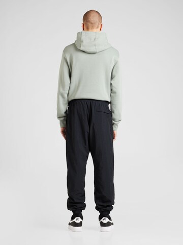 Nike Sportswear Дънки Tapered Leg Панталон в черно