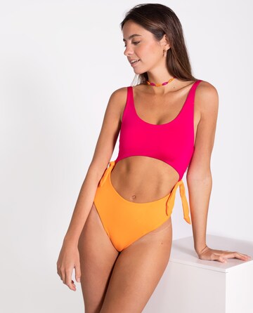 THE-ARE Bandeau Swimsuit in Pink: front