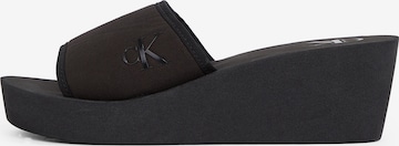 Saboți de la Calvin Klein Jeans pe negru: față