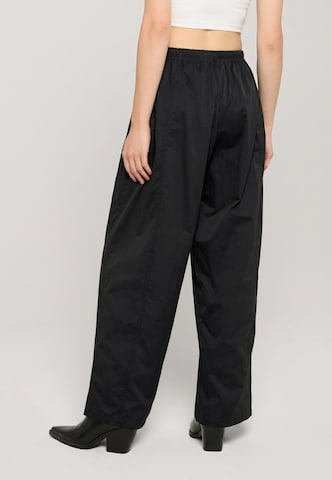 Wide leg Pantaloni di Urban Classics in nero