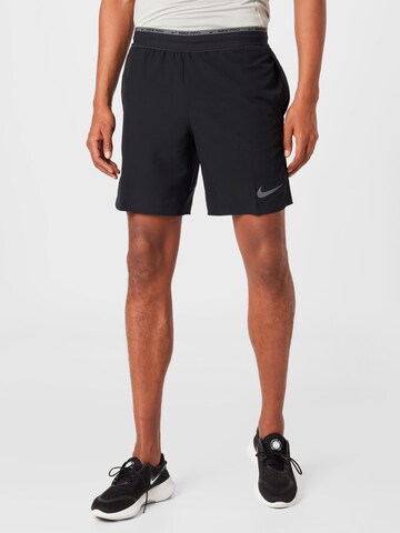 NIKE - Regular Calças de desporto em preto: frente